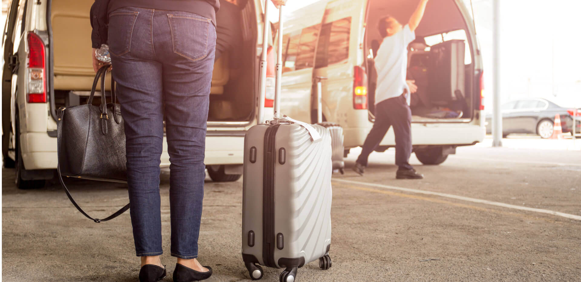 woman tourist standing with luggage with pick up van