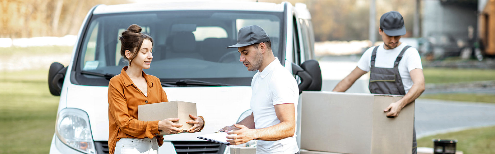 man handing a box to a woman