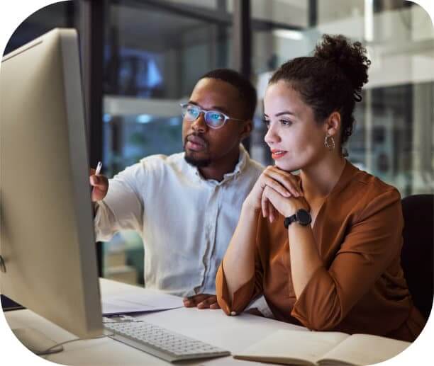 man and woman in office working