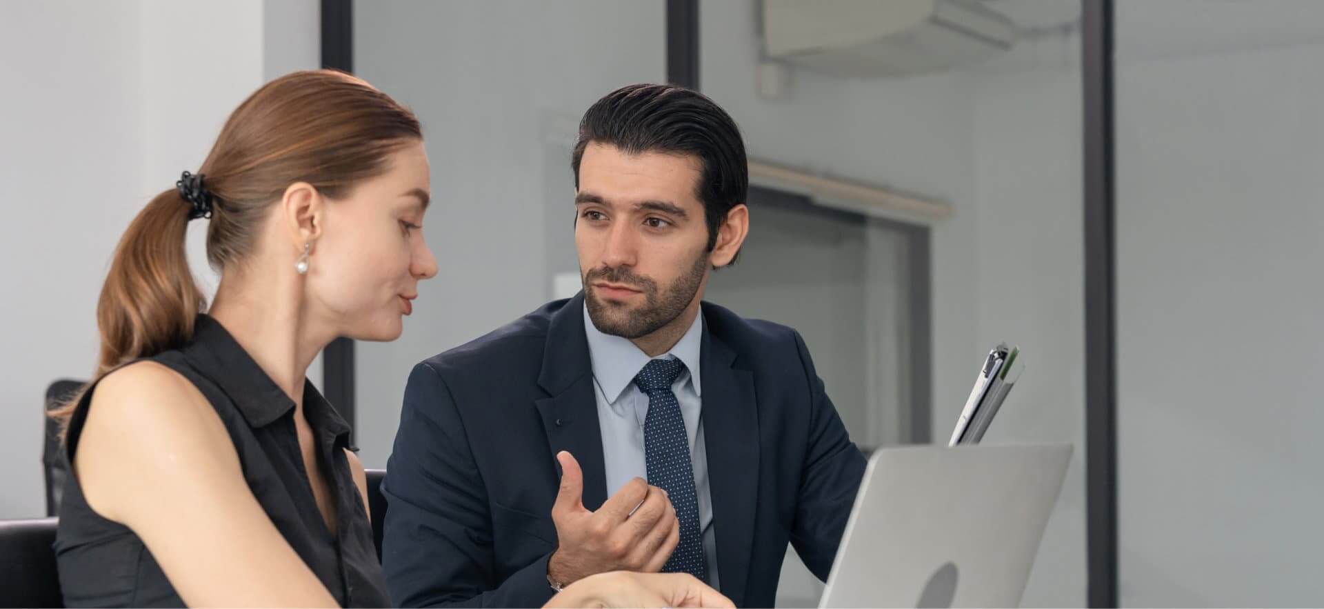 busy man and woman talking about business