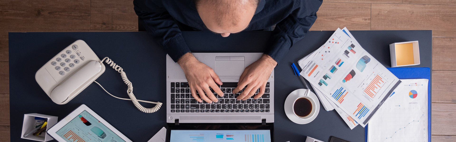 man sitting and working on his laptop